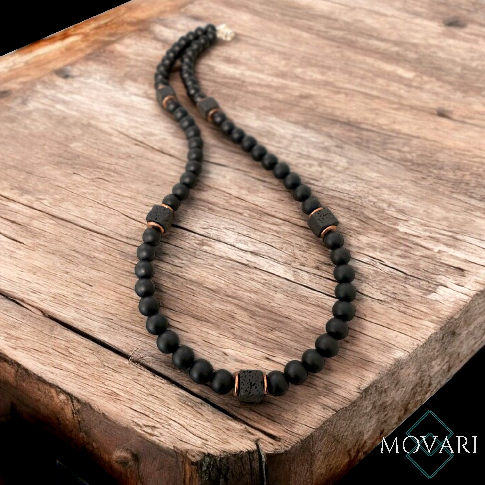 sleek necklace on wood