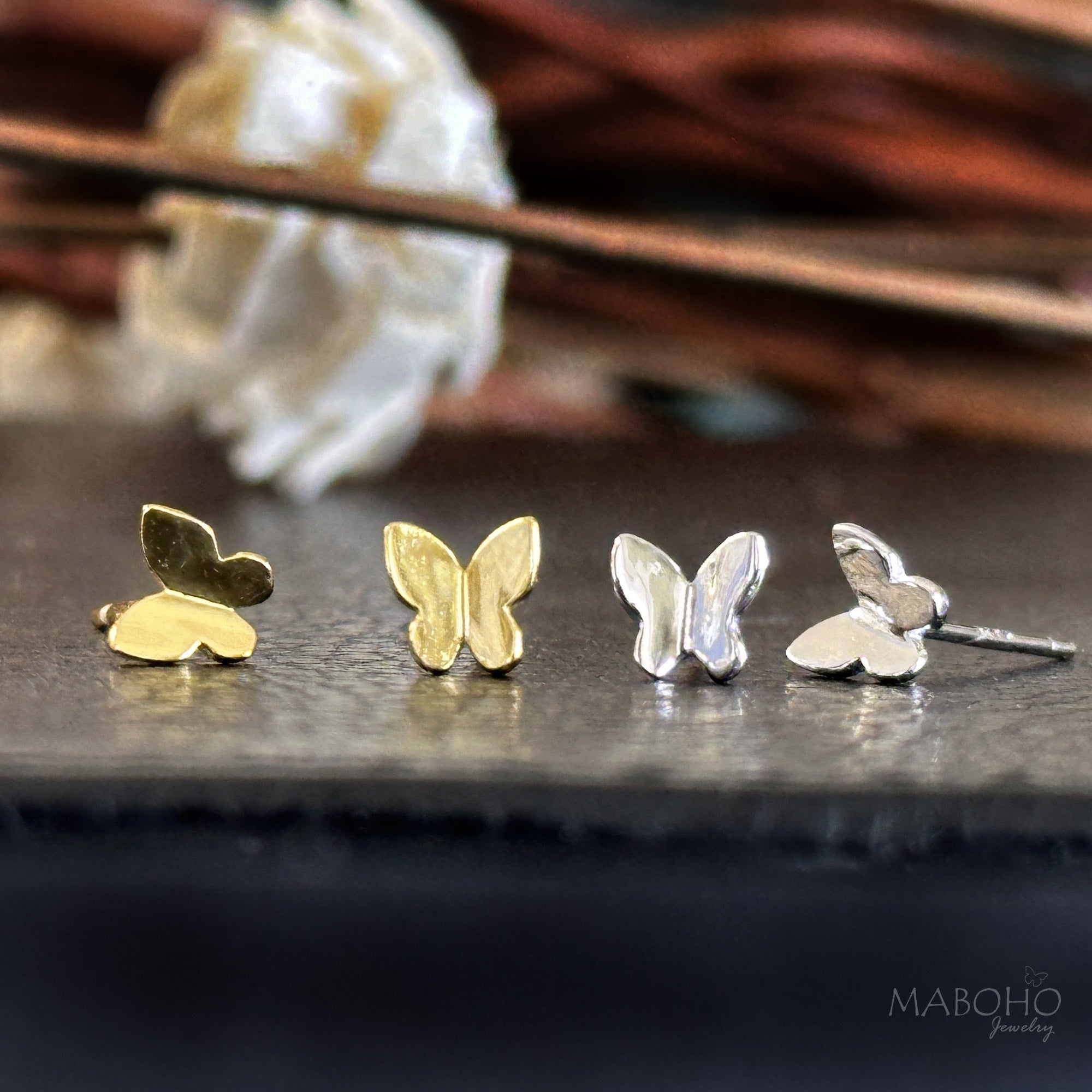 gold and silver earrings butterfly