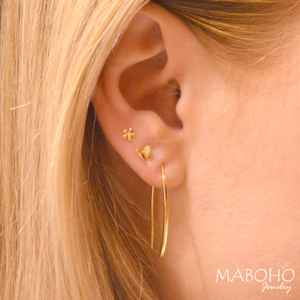 gold earring in ear