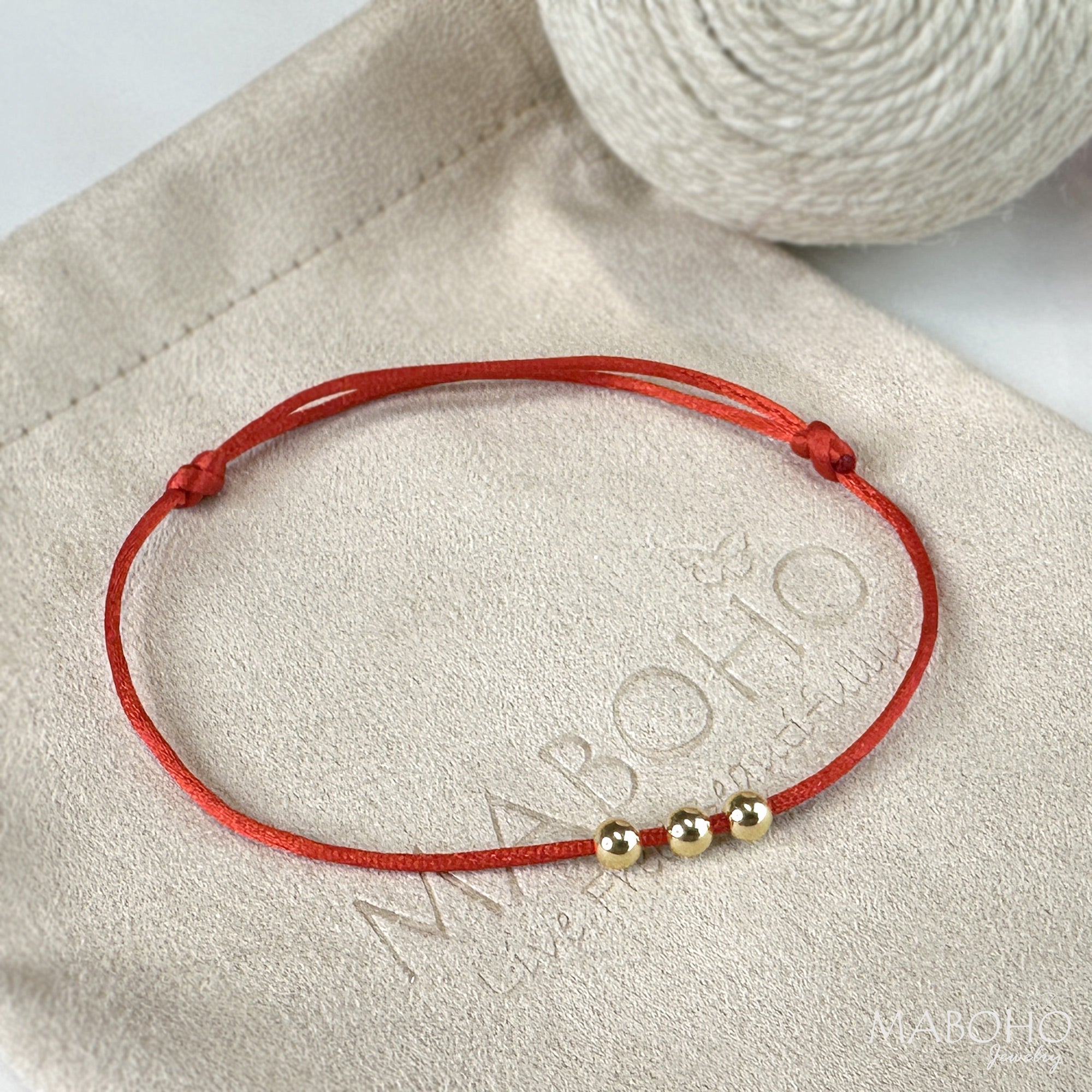 red string bracelet